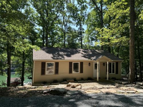 High Point House | Humble Hideaway - Inviting lakefront home with firepit, balcony & W/D - dog-friendly