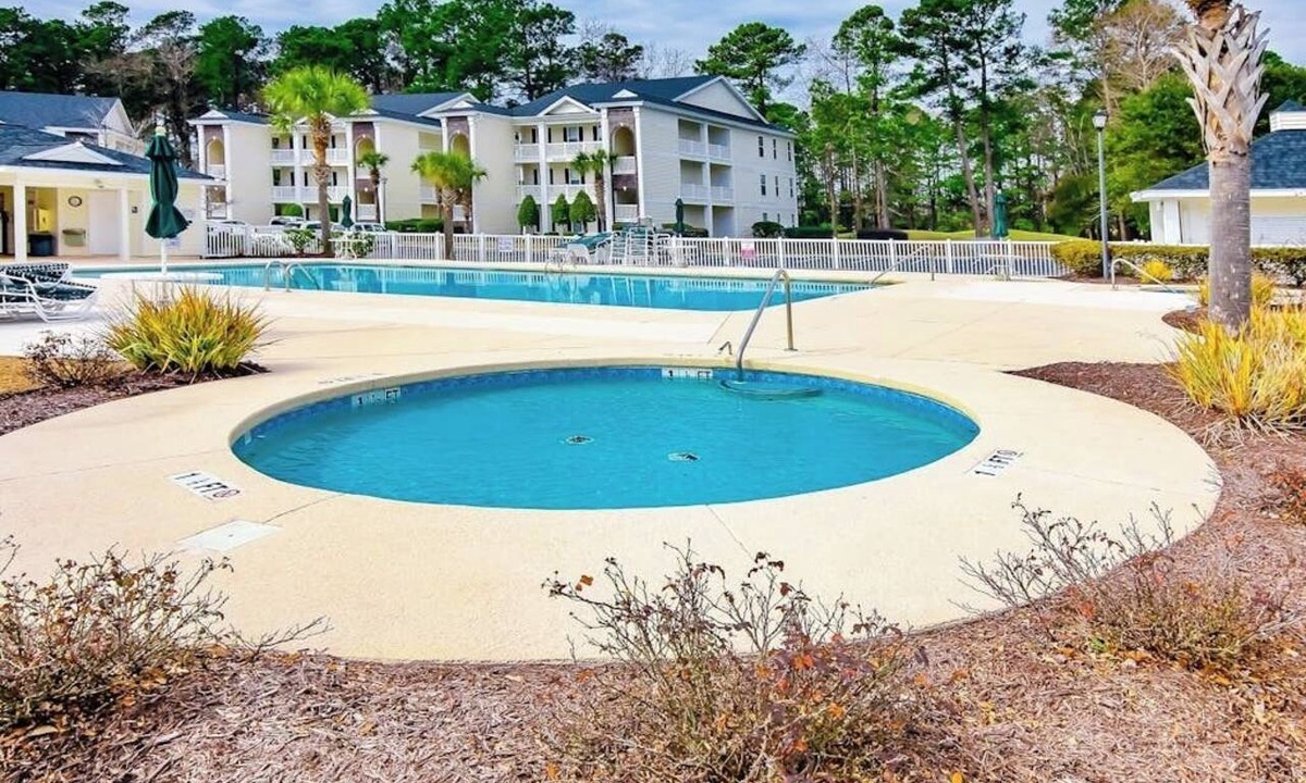 Carolina Forest Condo | Spacious condo with screened balcony & shared pool - near golf/beach/shops